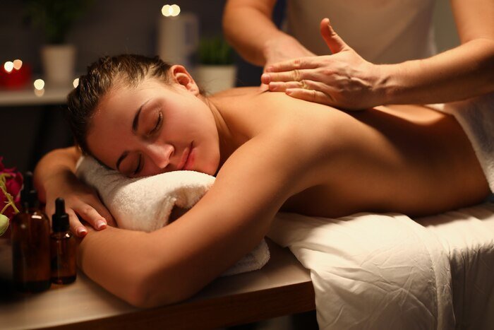 Therapist giving a back massage at The Royal Spa Thane